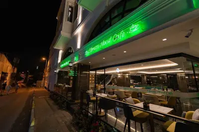 a restaurant with tables and chairs outside at night at Costera Hotel in Istanbul