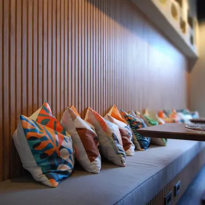 a row of colorful pillows sitting on a bench at Four Sides Beyoglu in Istanbul