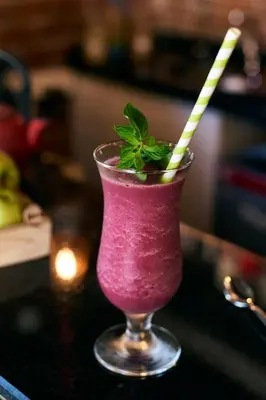 a pink drink with two straws in a glass at Sunlight Hotel in Istanbul