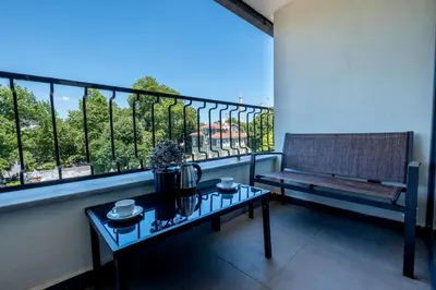 a balcony with a bench and a table in front of a window at Armagrandi Spina Hotel-Special Category in Istanbul