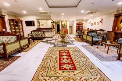 a living room with a rug on the floor at Hotel Saba in Istanbul