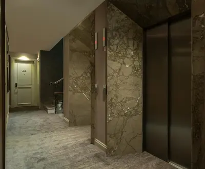 a hallway of a hotel with marble walls at Hotel Nena Sultanahmet in Istanbul