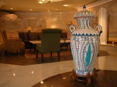 a large vase sitting on a table in a room at Eresin Hotels Sultanahmet - Boutique Class in Istanbul