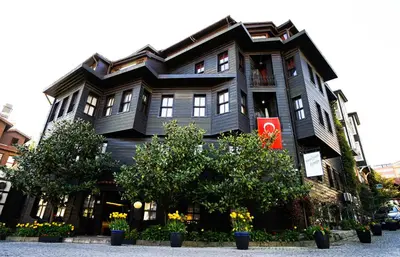 a black building with flowers in front of it at Yusufpasa Konagi - Special Class in Istanbul