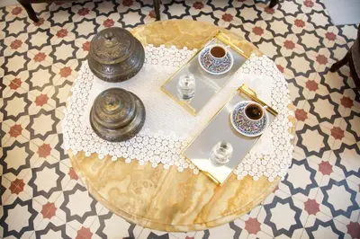 a glass table with a letter v on top of it at Yusufpasa Konagi - Special Class in Istanbul