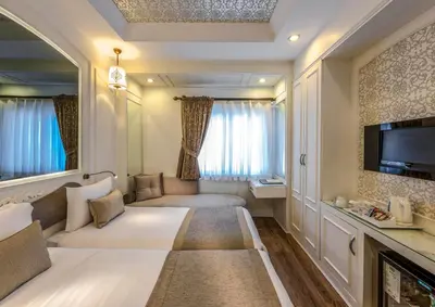 a hotel room with a large living room at Hotel Yasmak Sultan in Istanbul