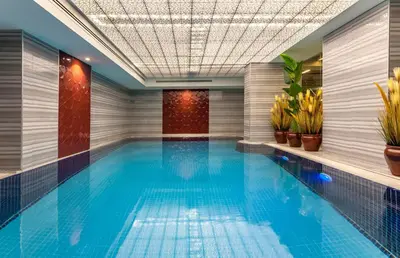 a swimming pool in a hotel with plants at Hotel Yasmak Sultan in Istanbul