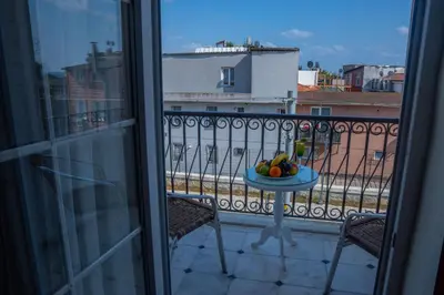 a balcony with a bowl of fruit on a table at Avicenna Hotel Sultanahmet in Istanbul