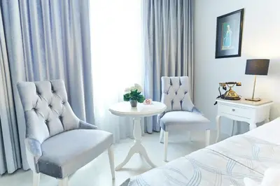 a bedroom with two chairs and a table and a bed at Celal Sultan Hotel Special Class in Istanbul