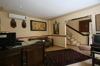 a living room with a couch and a television at Hanedan Hotel in Istanbul