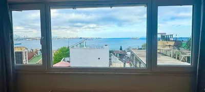 a window with a view of a body of water at Hanedan Hotel in Istanbul