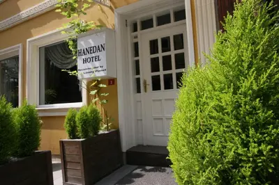 a front door of a house with potted plants at Hanedan Hotel in Istanbul