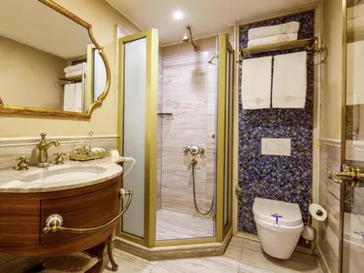 a bathroom with a shower and a toilet and a sink at Romance Istanbul Hotel Boutique Class in Istanbul