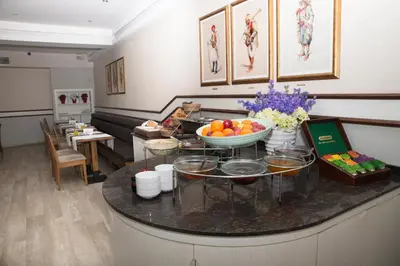 a room with a counter with a bowl of fruit on it at Ilkay Hotel in Istanbul