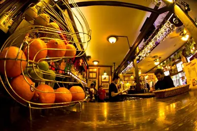 a bar with a basket of fruit on the counter at Ilkay Hotel in Istanbul