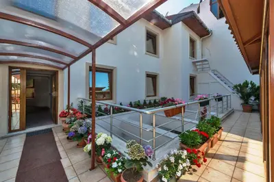an indoor garden with flowers in pots on a building at Zeynep Sultan Hotel in Istanbul