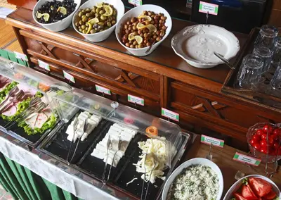 a buffet with different types of food on a table at Dersaadet Hotel Istanbul in Istanbul