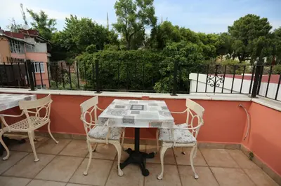a table and chairs sitting on a balcony at Hotel Tashkonak Istanbul in Istanbul