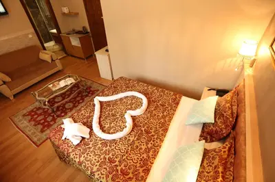a room with a bed with a white object on it at Hotel Tashkonak Istanbul in Istanbul