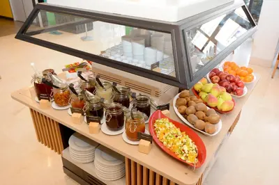 a display case with food and drinks on a shelf at Holiday Inn Istanbul City by IHG in Istanbul