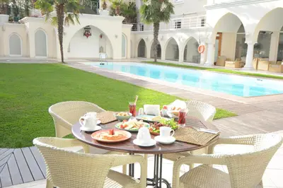a table with food on it next to a pool at Holiday Inn Istanbul City by IHG in Istanbul