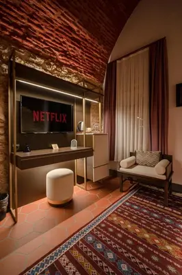 a living room with a netflix sign on the wall at Han 1772 Hotel in Istanbul