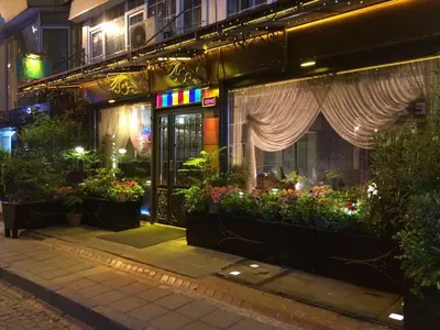 a building with flowers and plants in front of it at Hotel Nezih Istanbul in Istanbul