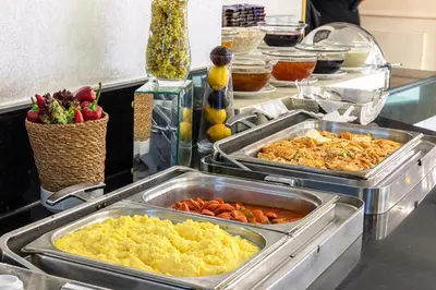 a buffet with two trays of food on a counter at Hotel Ipek Palas in Istanbul