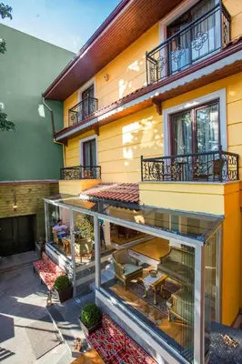 a balcony of a building with a patio at Garden House Hotel - Special Class in Istanbul