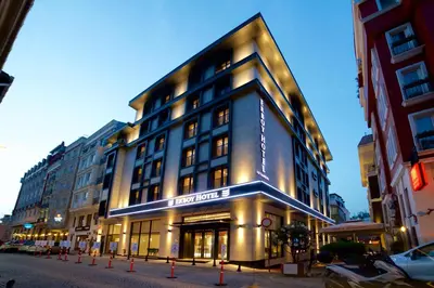 a large building on a city street at night at Erboy Hotel Istanbul Sirkeci in Istanbul
