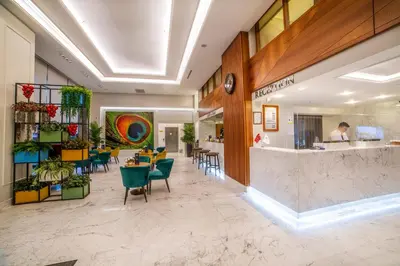 a lobby of a store with a counter and chairs at Erboy Hotel Istanbul Sirkeci in Istanbul