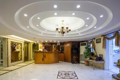 a large room with a ceiling with a chandelier at Hotel Historia-Special Category in Istanbul