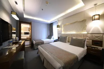 a hotel room with a large bed and a television at Grand Star Hotel Bosphorus & Spa in Istanbul