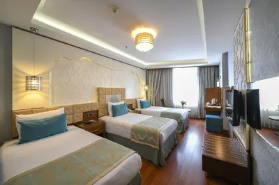 a hotel room with two beds and a television at Grand Star Hotel Bosphorus & Spa in Istanbul