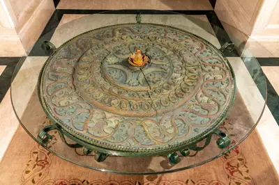 a glass table with a statue on top of a floor at Hotel Sultanhan - Special Category in Istanbul