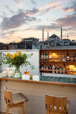 a bar with a vase of flowers on a balcony at Armada Istanbul Old City Hotel in Istanbul