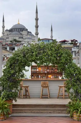 a bar with two benches and a view of a mosque at Armada Istanbul Old City Hotel in Istanbul