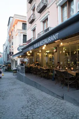 a restaurant with tables and chairs outside of a building at Hotel Agan Oldcity Istanbul in Istanbul