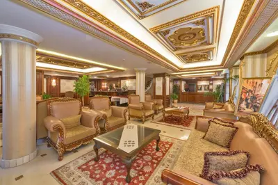 a living room with furniture and a coffered ceiling at Golden Horn Hotel in Istanbul