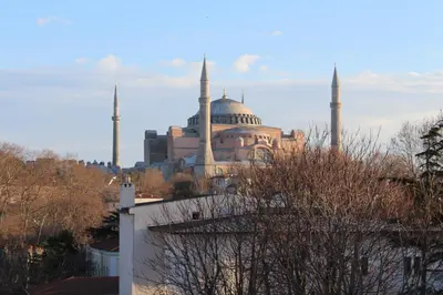 a view of a mosque with its minarets on a city at Golden Horn Hotel in Istanbul