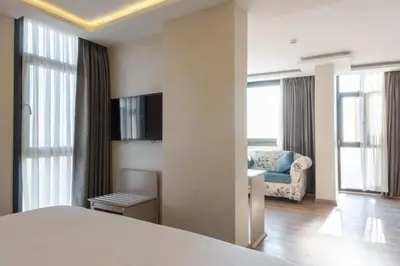 a hotel room with a bed and a chair at Antik Hotel Istanbul in Istanbul