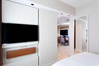 a bedroom with a flat screen tv on a wall at Radisson Hotel Istanbul Sultanahmet in Istanbul
