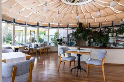 a restaurant with chairs and tables and a ceiling at Radisson Hotel Istanbul Sultanahmet in Istanbul