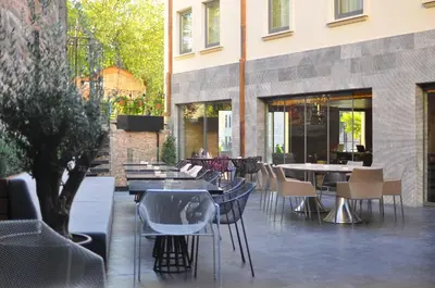 a restaurant with tables and chairs and a building at Hotel Saint Sophia in Istanbul