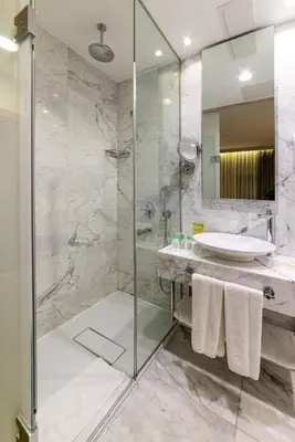 a bathroom with a glass shower and a sink at Hotel Saint Sophia in Istanbul
