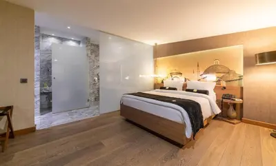 a bedroom with a large bed and a bathroom at Hotel Saint Sophia in Istanbul