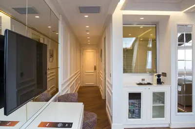 a hallway with a large television and a living room at Mina Hotel - Special Category in Istanbul