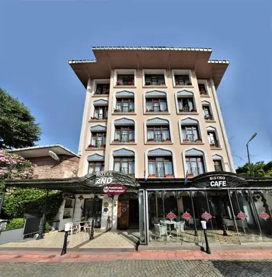 a tall building with tables and chairs in front of it at The And Hotel Sultanahmet - Special Category in Istanbul