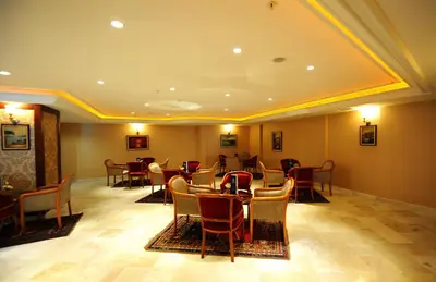 a restaurant with tables and chairs in a room at Askoc Hotel & SPA in Istanbul