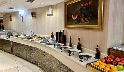 a buffet line in a hotel with food on it at Askoc Hotel & SPA in Istanbul